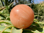 Polished Orange Twist Calcite Sphere x 1 From Madagascar