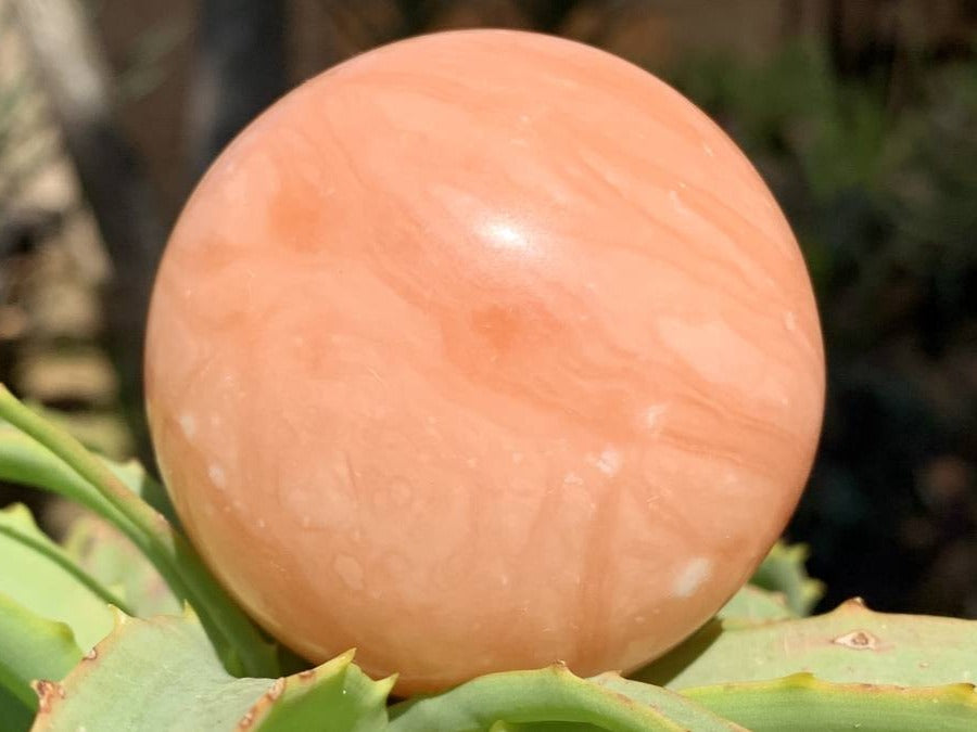 Polished Orange Twist Calcite Sphere x 1 From Madagascar
