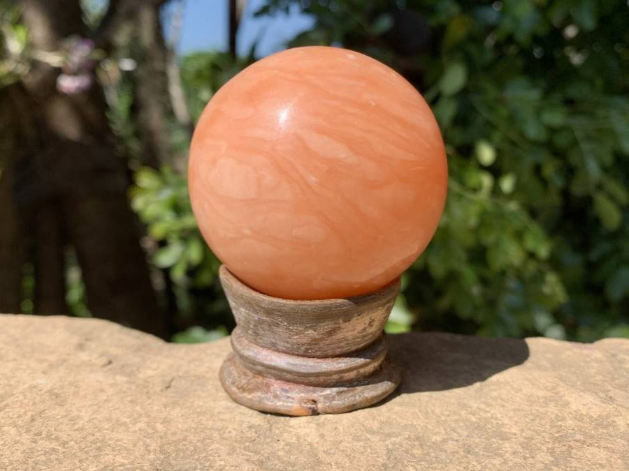 Polished Orange Twist Calcite Sphere x 1 From Madagascar