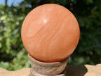 Polished Orange Twist Calcite Sphere x 1 From Madagascar