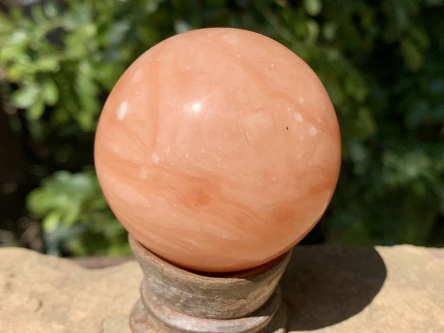 Polished Orange Twist Calcite Sphere x 1 From Madagascar