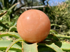 Polished Orange Twist Calcite Sphere x 1 From Madagascar