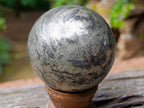 Polished Basalt and Pyrite Pharaoh Stone Sphere with Wooden Stand x 1 From Iron Duke Mine, Zimbabwe