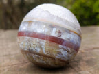 Polished Banded Agate Sardonyx Sphere with Crystalline Vug x 1 From Zimbabwe