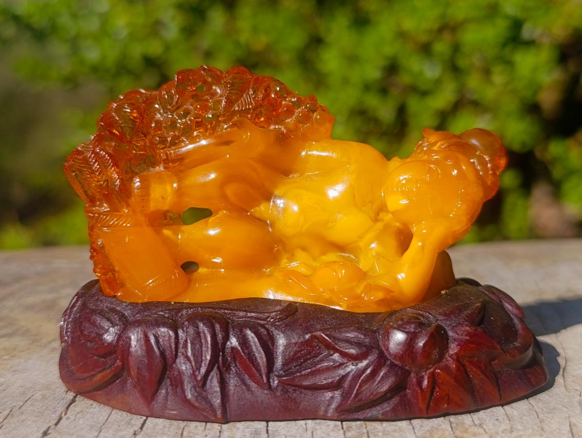 Polished Fossil Amber Carved Sleeping Princess on a Hardwood Base x 1 From Poland