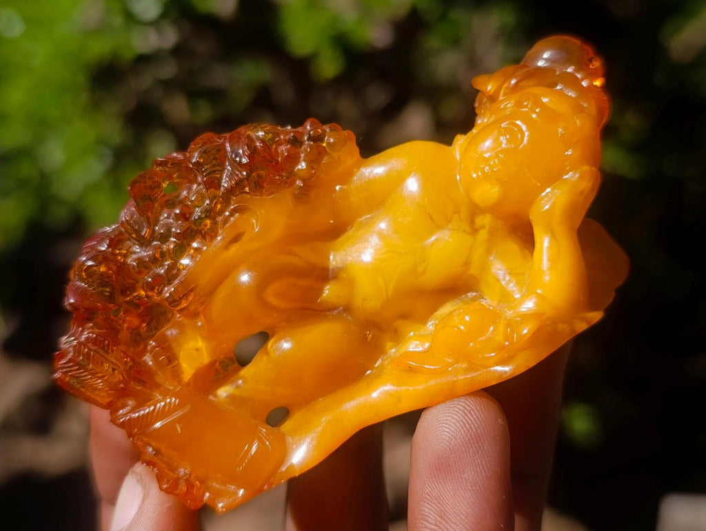 Polished Fossil Amber Carved Sleeping Princess on a Hardwood Base x 1 From Poland